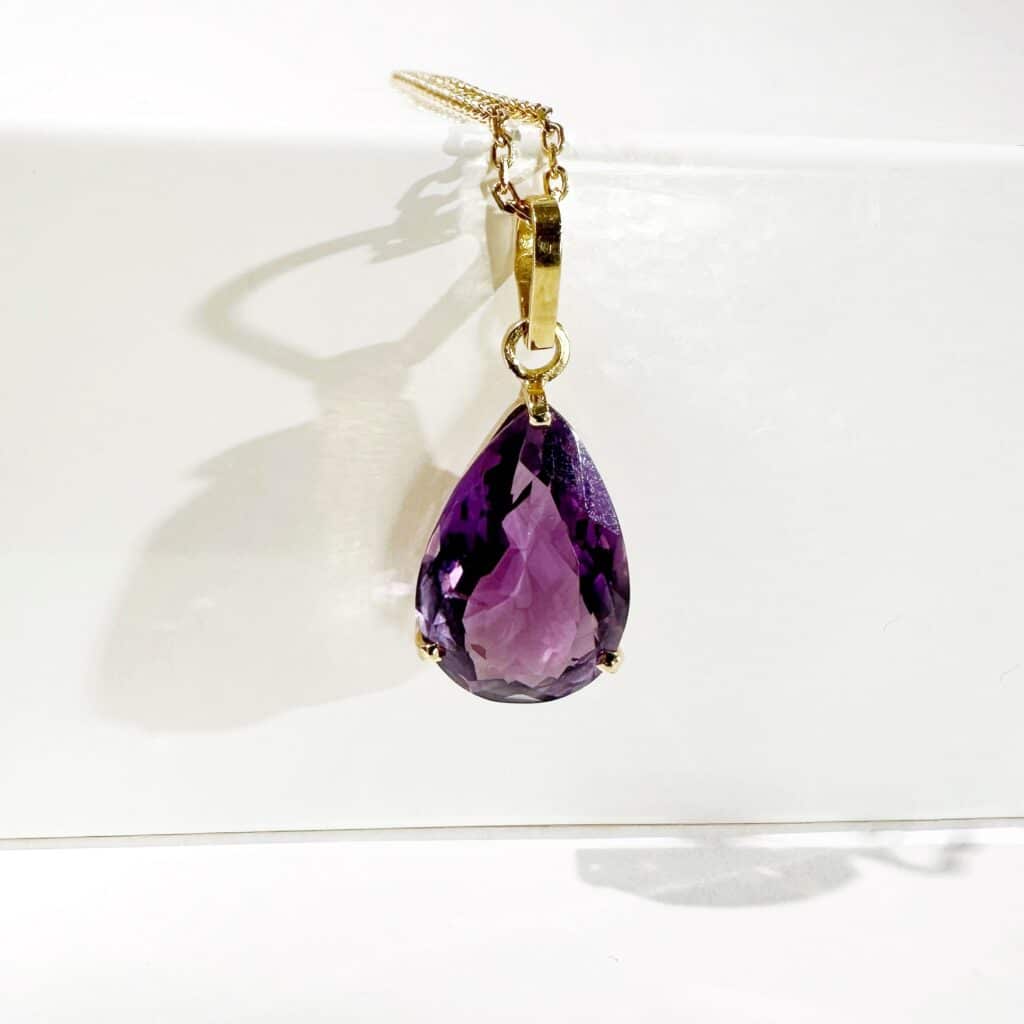 Gold and amethyst drop pendant 