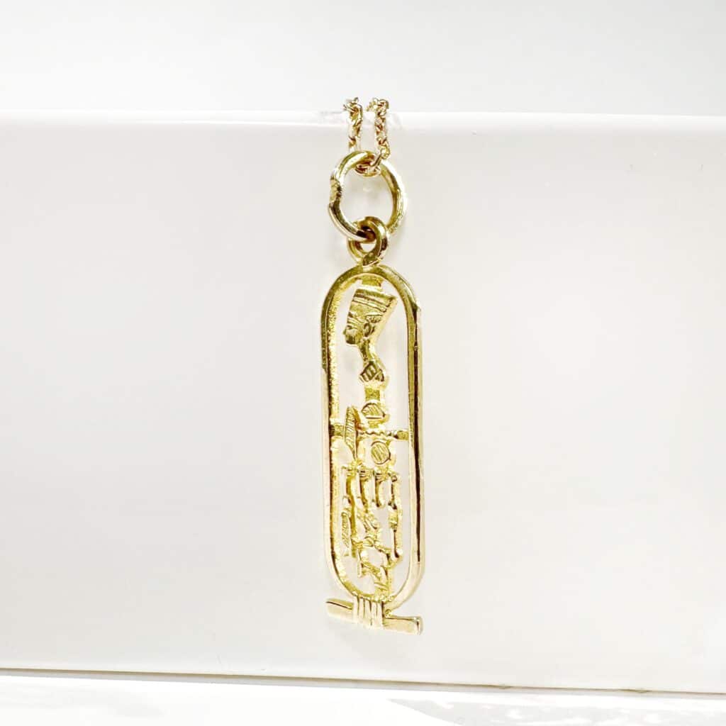 Gold cartouche pendant 