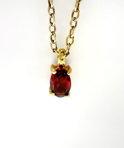 Gold and garnet pendant "Almondine"