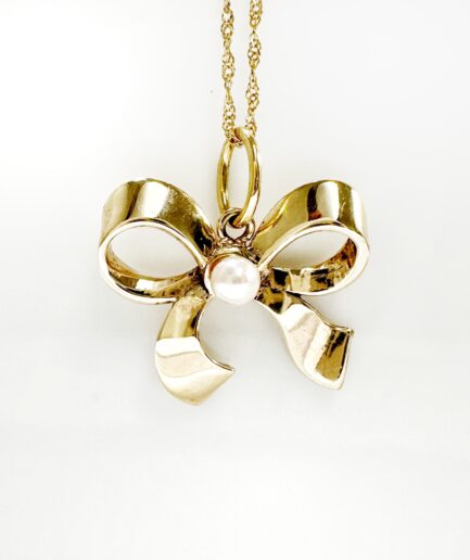 Gold and pearl bow ribbon pendant "Claren"